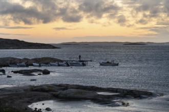 Small bay, archipelago, jetty with angler, Resö Island, Bohuslän, Skagerrak, Sotenäs, Västra