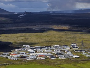 Lava, lava field, village, houses, summer, cloudy, sunny, aerial view, volcanic eruption, July