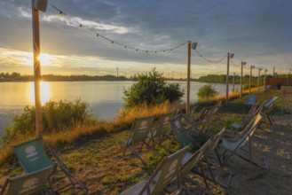 View from the outdoor area of a restaurant at Lankenauer Höft over deckchairs through a string of