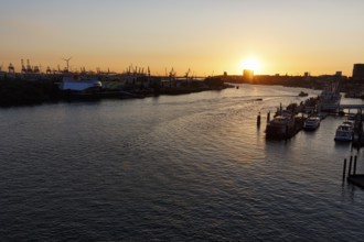 Hamburg harbour, view from the Elbphilharmonie over the Elbe at sunset, jetty, cranes of the