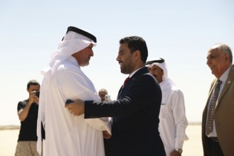 Syrian Health Minister Musab al-Omar welcomes a Qatari aircraft loaded with medical and