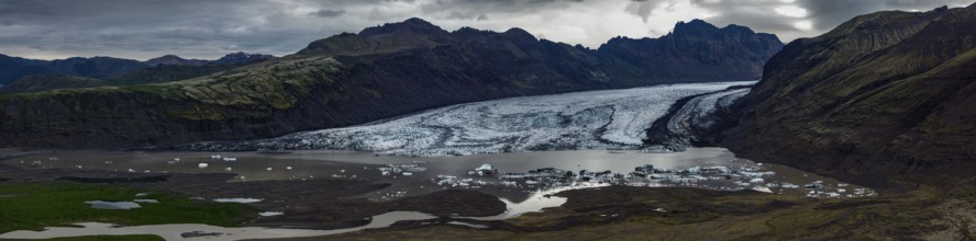 Glacier, glacier tongue, glacier lake, mountains, cloudy, aerial view, panorama, summer,
