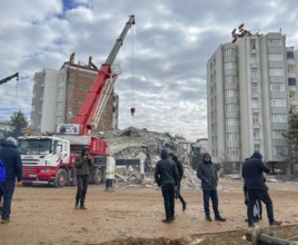 Turkish civil defense teams (AFAD) search for survivors under the rubble after a powerful 7