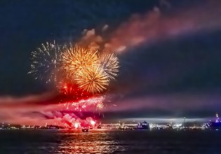 Lake Night Festival Constance. Water fireworks over the German shore and the neighbouring Swiss