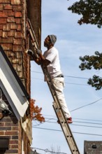 Detroit, Michigan - Workers remodel a house in the Morningside neighborhood that had been vacant