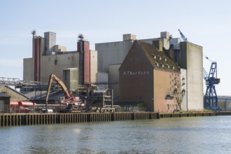 Grain silos, warehouses, land trade, outer harbour, Husum, North Frisia, North Sea,