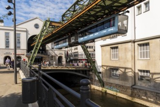 The Wuppertal suspension railway arrives at the Döppersberg stop in the city centre of Wuppertal,