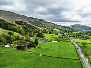 Farms and Mountains over road A591 from a drone, Grasmere Lake, Grasmere, Ambleside, Lake District,