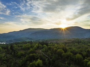 Sunset over Mountains and Coniston Water from drone, Lake District National Park, Cumbria, England,
