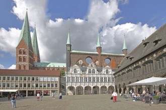 Renaissance and Gothic town hall and pedestrians, tourists, Brick Gothic, brick buildings, market,