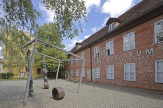 Cultural Forum and Schleswig-Holstein House, brick building, sculpture, inscription, Schelfstadt,