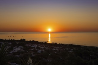 The sun rises on the Costa Rei, a stretch of coastline on the Italian Mediterranean island of