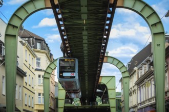 The Wuppertal suspension railway pulls into the Sonnborn stop, Wuppertal, Germany, digitally