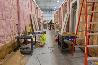 Romulus, Michigan - Workers build apartments in Ginosko Modular 's factory using modular
