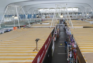 Raised view over roofs of market stalls in Market Building or Pannier Market, city of Plymouth,