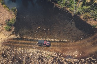 Landrover crosses river in Australian outback in the Kimberley, North West Australia, Australia