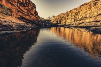 Bell Gorge waterfall, a body of water in north-west Australia in the Kimberley. Sunrise in the
