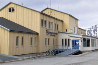 Hospital, yellow wooden house, Longyearbyen, Spitsbergen, Svalbard