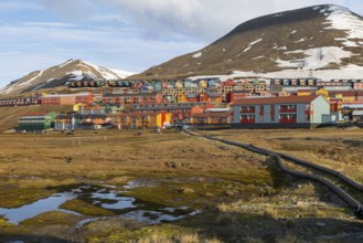 Colourful houses with exposed supply lines, Longyearbyen, Spitsbergen, Svalbard