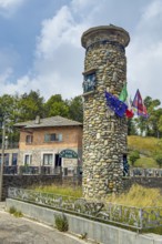 1955 on 1311 m high pass summit of Alpine pass asphalted road pass built round tower erected