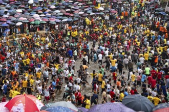 People from the Pnar community march in a circle as they celebrate an event organized to mark the