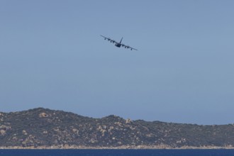 A Lockheed Martin MC-130J Commando II, a US Air Force military aircraft, flies low over Costa Rei,