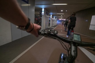 Ride your bike into and out of the bicycle car park at Utrecht Centraal station, Stationsplein,