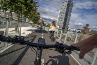 Cycling over the Moreelsebrug, pedestrian and cyclist bridge over the tracks of Utrecht Centraal,