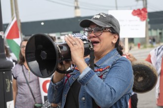 Detroit, Michigan USA - 26 July 2025 - Protesters rally at Eastern Market, banging empty pots to