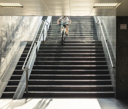 A cyclist descends a staircase on a mountain bike, Capital of Culture 2026, Trencín, Slovakia