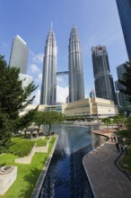 Petronas twin towers and Symphony Lake in KLCC park, Kuala Lumpur, Malaysia, Asia