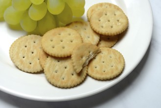 Crackers, crackers with grapes on a plate