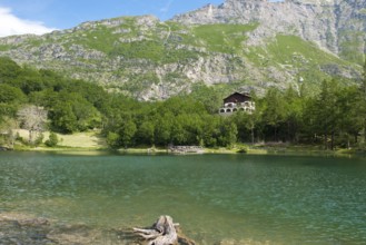 View of mountain lake Lago Grande near Moncenisio in Val Cenischia in the Graian Alps, behind it