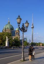 Road traffic and pedestrians on the carriageway in Berlin-Mitte, Unter den Linden, Berlin, Germany