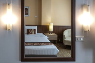 Symbol photo hotel room mirror bed