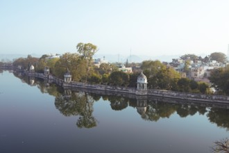 Pagodas in the Swaroop Sagar Garden on Lake Pichola in the morning light, Udaipur, Rajasthan, India