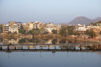 Udaipur and the Swaroop Sagar Lake in the morning light, Rajasthan, India