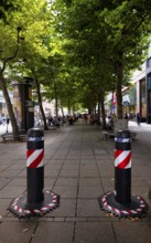 Automatic, electrically retractable bollards to protect against terrorist attacks, pedestrian zone,