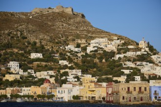 Panteli Fortress, coastal landscape with white houses on a hill and a fortress on top, Agia Marina,