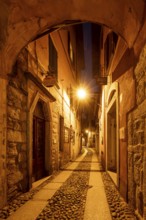 Alley illuminated at night, old town centre, Orta San Giulio, on Lake Orta, Province of Novara,