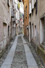 Alley in the historic centre of Orta San Giulio, on Lake Orta, Province of Novara, Piedmont, Italy