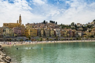 Town with colourful houses by the sea, Plage des Sablettes, Menton, Alpes Maritimes, Provence Alpes