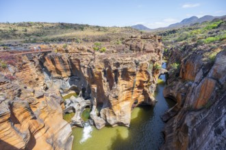 Bridges over a canyon with steep orange-coloured cliffs and the Blyde River, Bourke's Luck