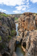 Bridges over a canyon with steep orange-coloured cliffs and the Blyde River, Bourke's Luck
