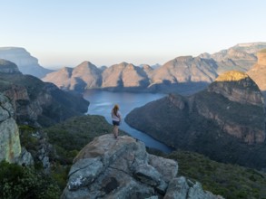 Hiker enjoying panorama, Blyde River Canyon with summit Three Rondawels, view of canyon with river
