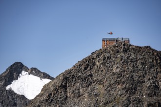 Becherhaus mountain hut on the summit of the Becher, helicopter to supply the mountain hut, Stubai