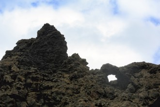 Tuff formation in Dimmuborgir, bizarrely shaped rock formation, rock arch in the lava field, Krafla