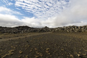 Hiker, hiking trail between Dettifoss and Selfoss, volcanic landscape, Cumulus, North Iceland,