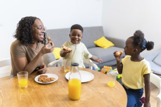 Mother and children enjoying a healthy breakfast together at the dining table, creating a warm and