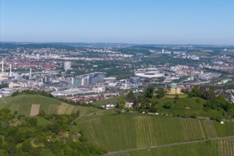 Panoramic picture of a cityscape with a building on a vineyard hill, view of the burial chapel of